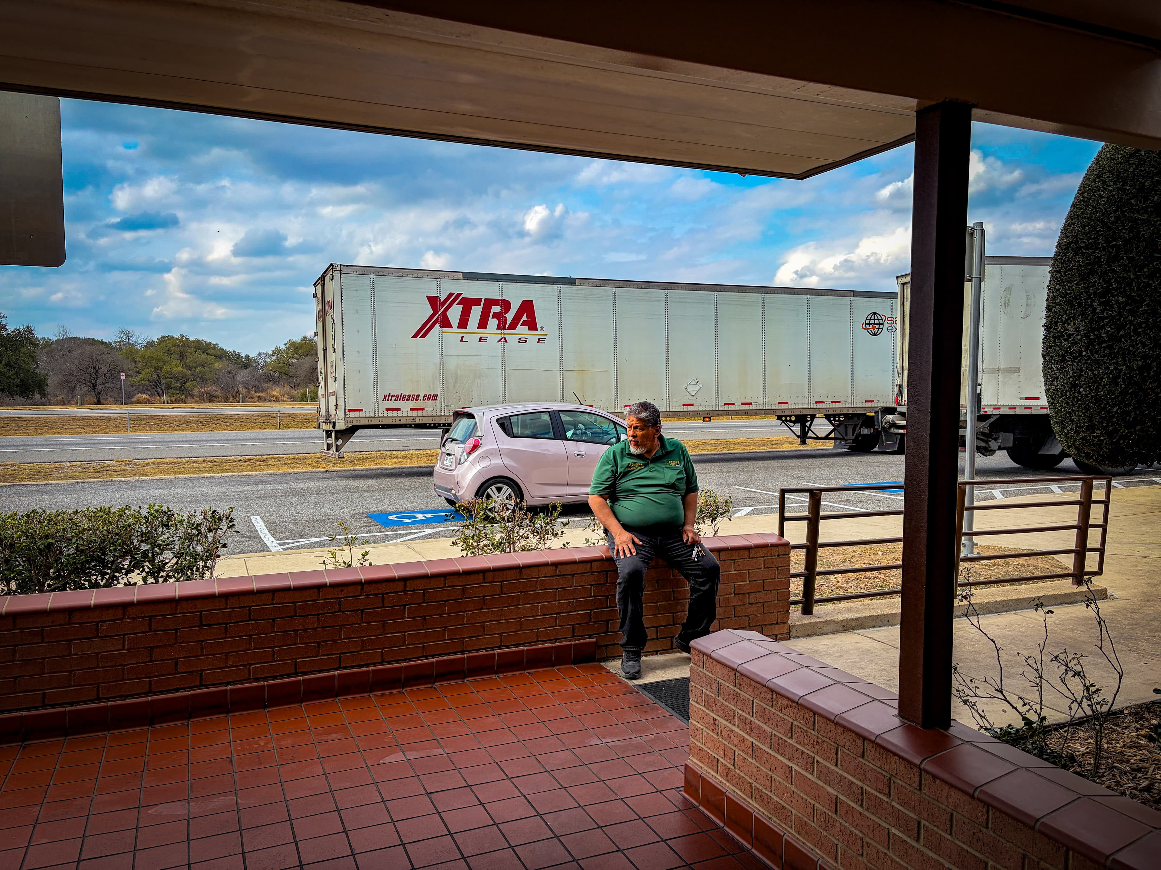 Johny's dad sitting with the Austin Marathon medals