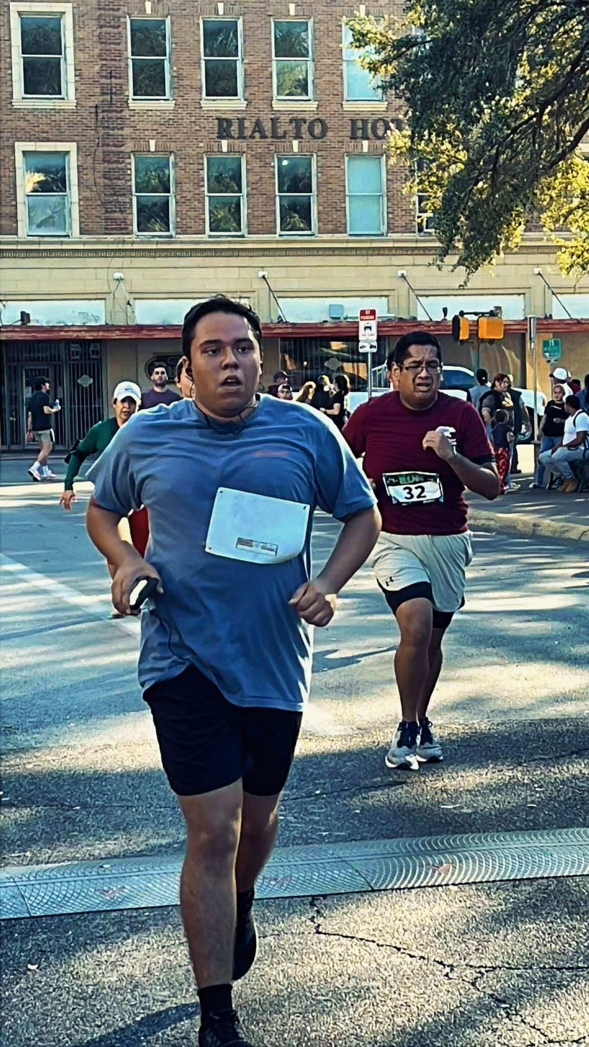 Runner mid-stride on a sunny day