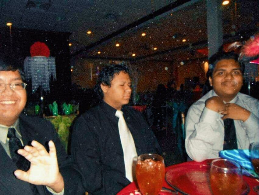 Three runners posing together