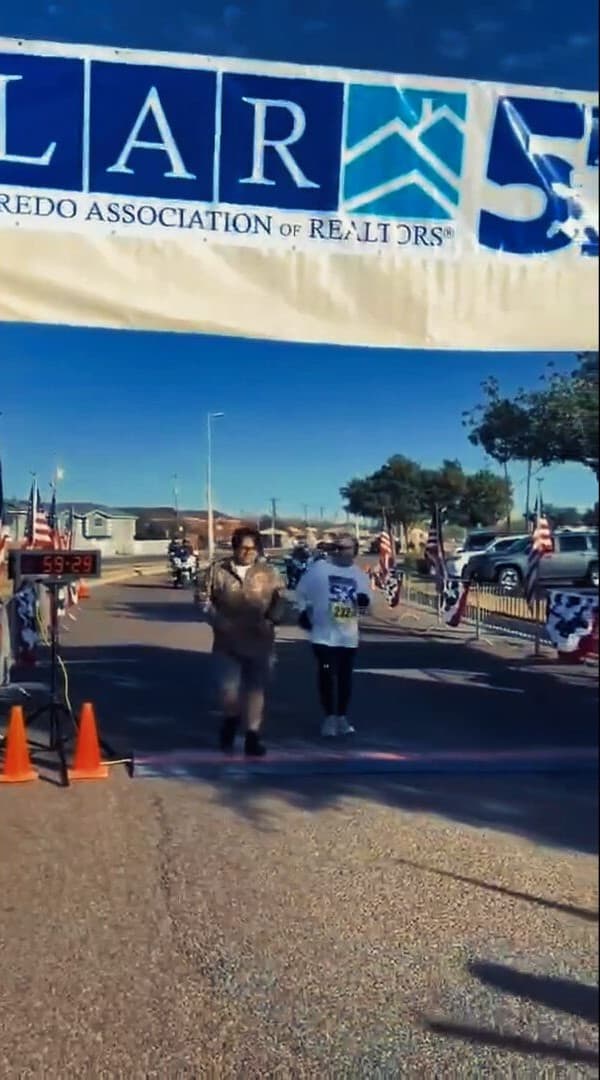 Runner crossing a scenic trail