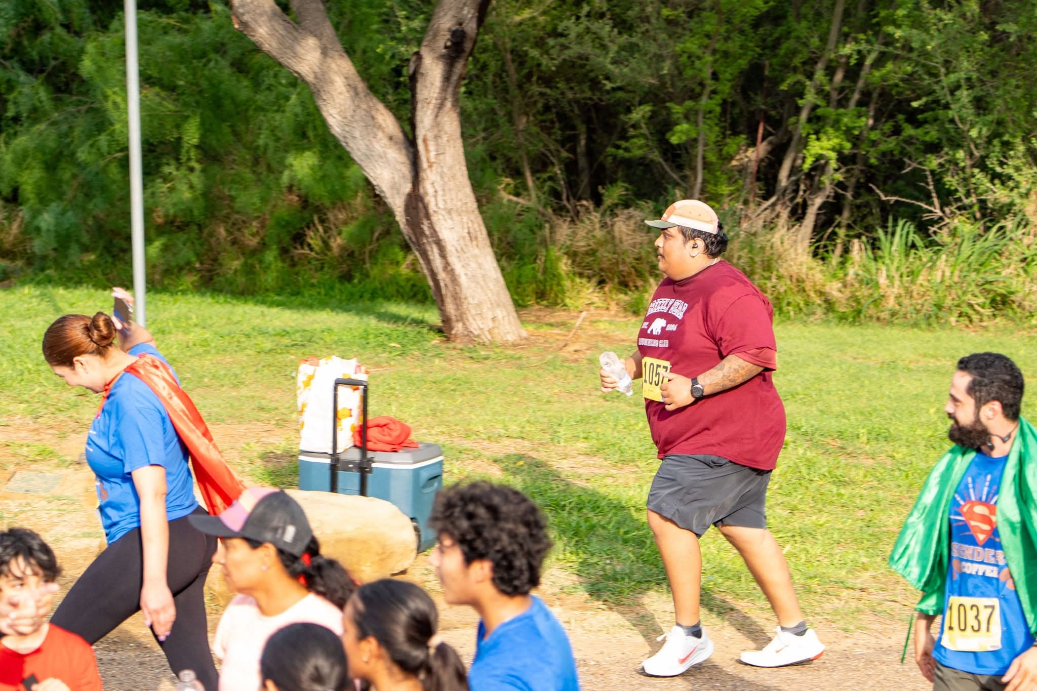 Runners on the course during a sunny day